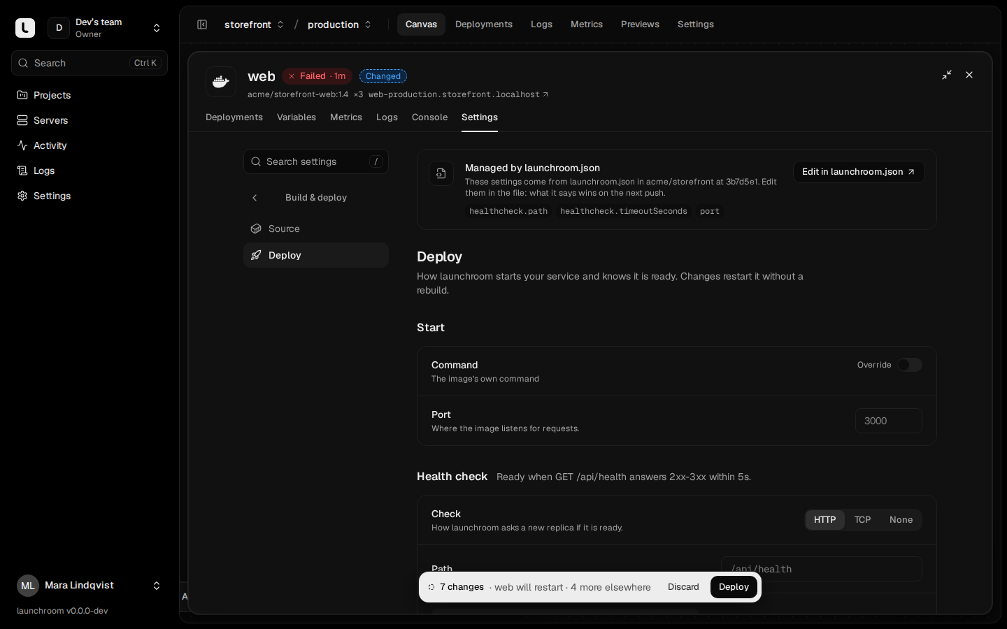 Deploy settings of web with a banner 'Managed by launchroom.json' listing the fields the file controls, an Edit in launchroom.json link, and start command, port and health check settings.