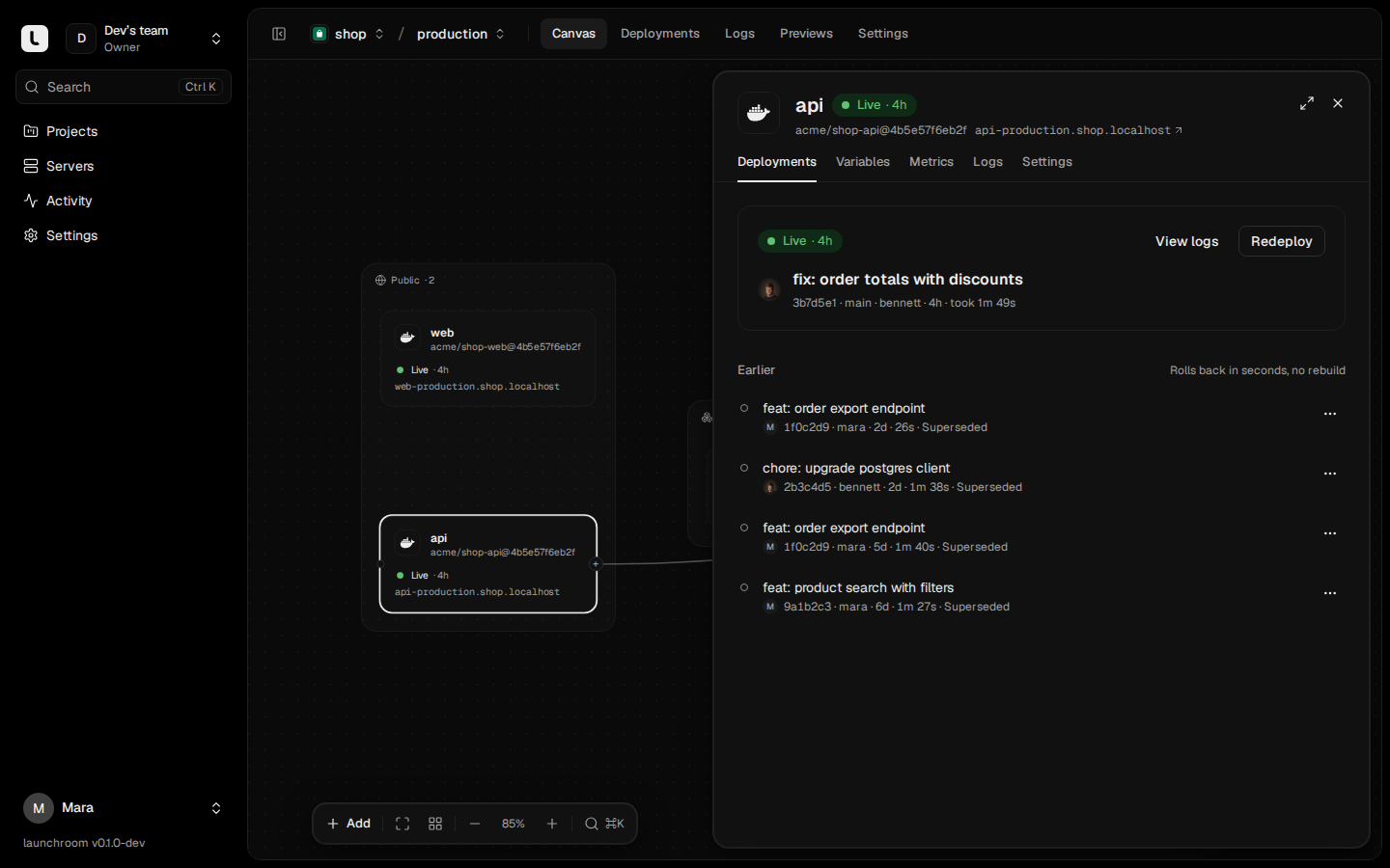 Service panel for api open beside the canvas, Deployments tab: the live deployment 'fix: order totals with discounts' with View logs and Redeploy, and four earlier deployments that can be rolled back.